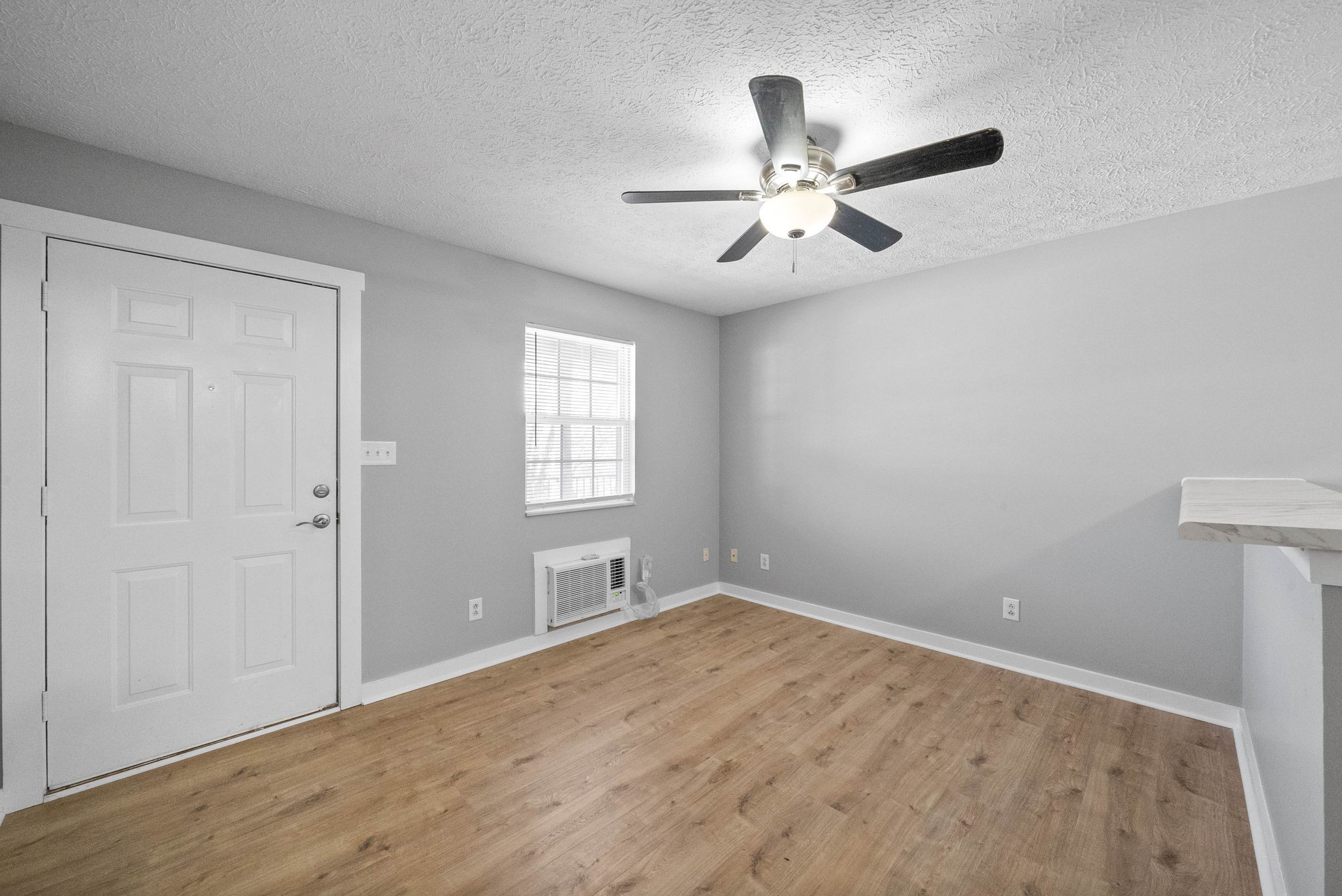 765 Robb Avenue, Unit 2 Clarksville, TN 37040 - Photo 12 of 24 an empty room with windows and fan