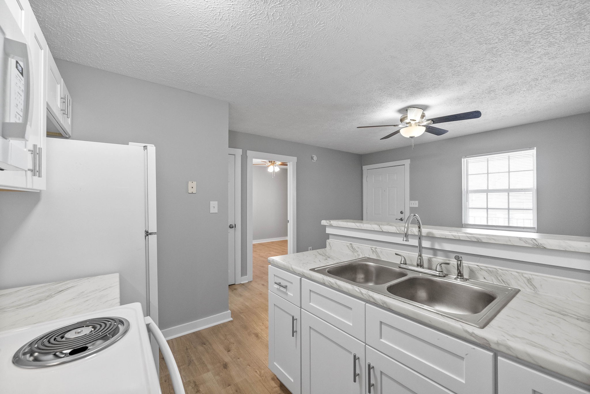 765 Robb Avenue, Unit 2 Clarksville, TN 37040 - Photo 17 of 24 a kitchen with a sink stove and refrigerator