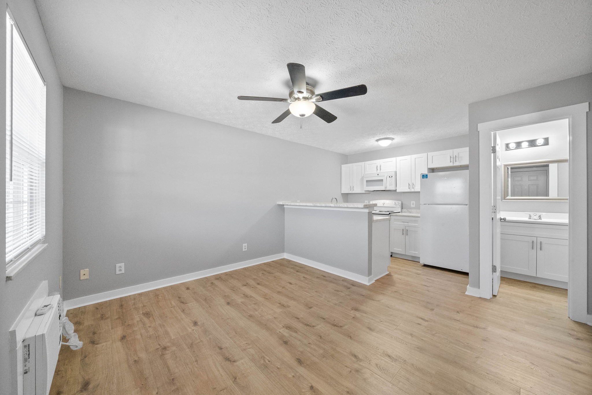765 Robb Avenue, Unit 2 Clarksville, TN 37040 - Photo 9 of 24 a view of a kitchen with wooden floor and a kitchen