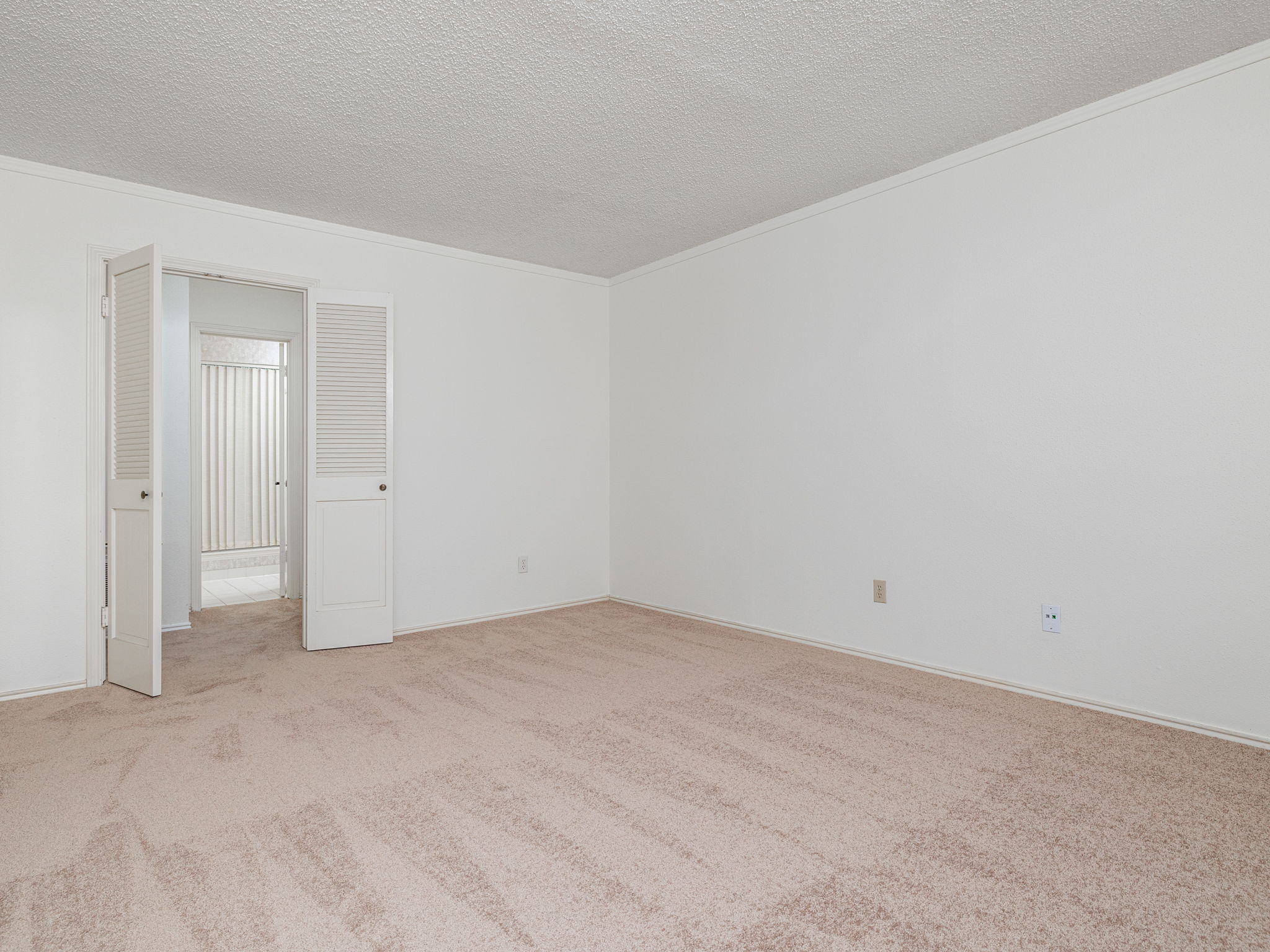8216 Summer Side Drive Austin, TX 78759 - Photo 20 of 32 Another view of the primary bedroom looking into its bathroom