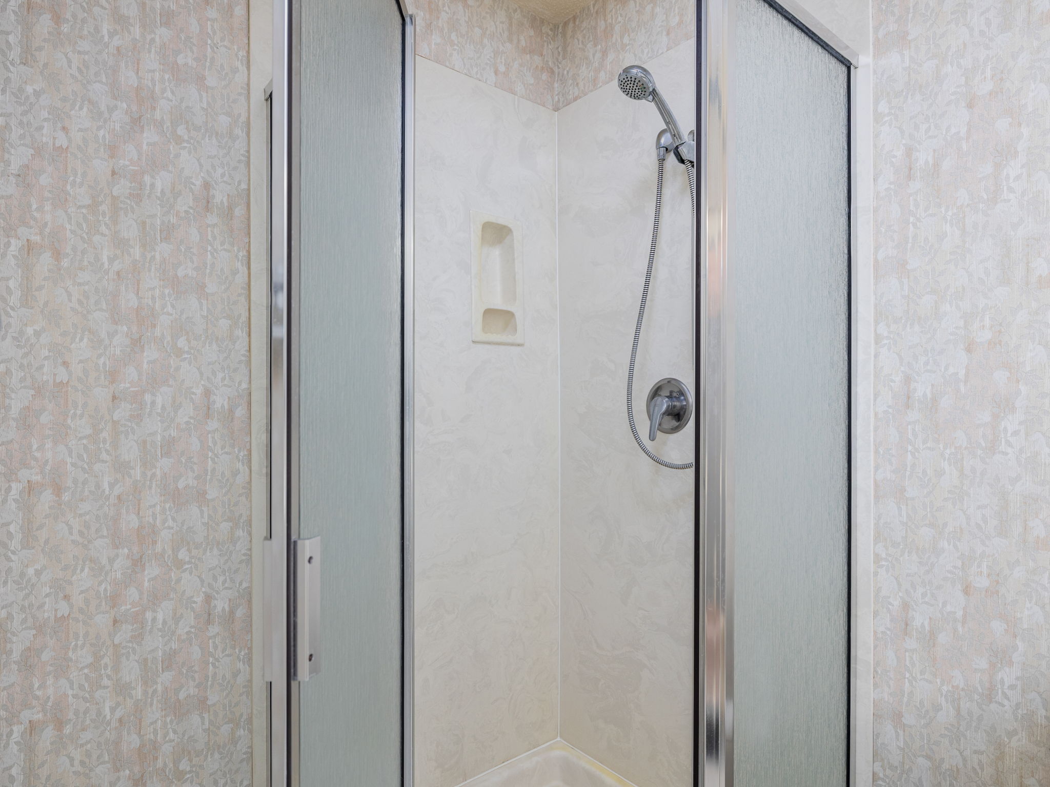 8216 Summer Side Drive Austin, TX 78759 - Photo 22 of 32 The shower area in the primary bathroom