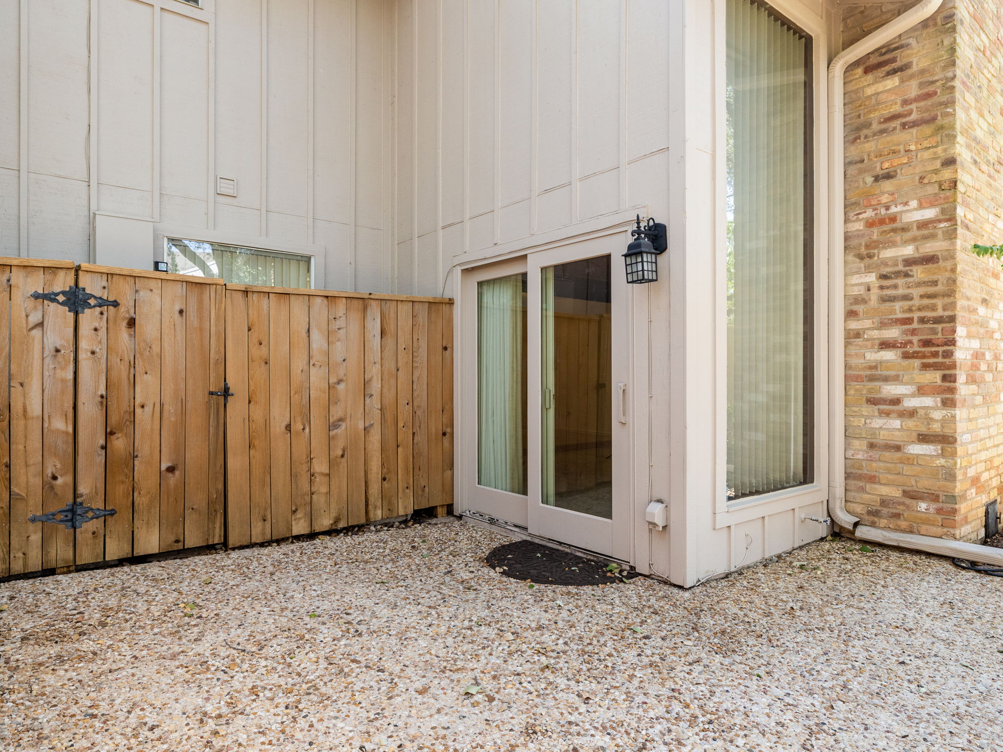 8216 Summer Side Drive Austin, TX 78759 - Photo 26 of 32 The sliding door leads into the family room