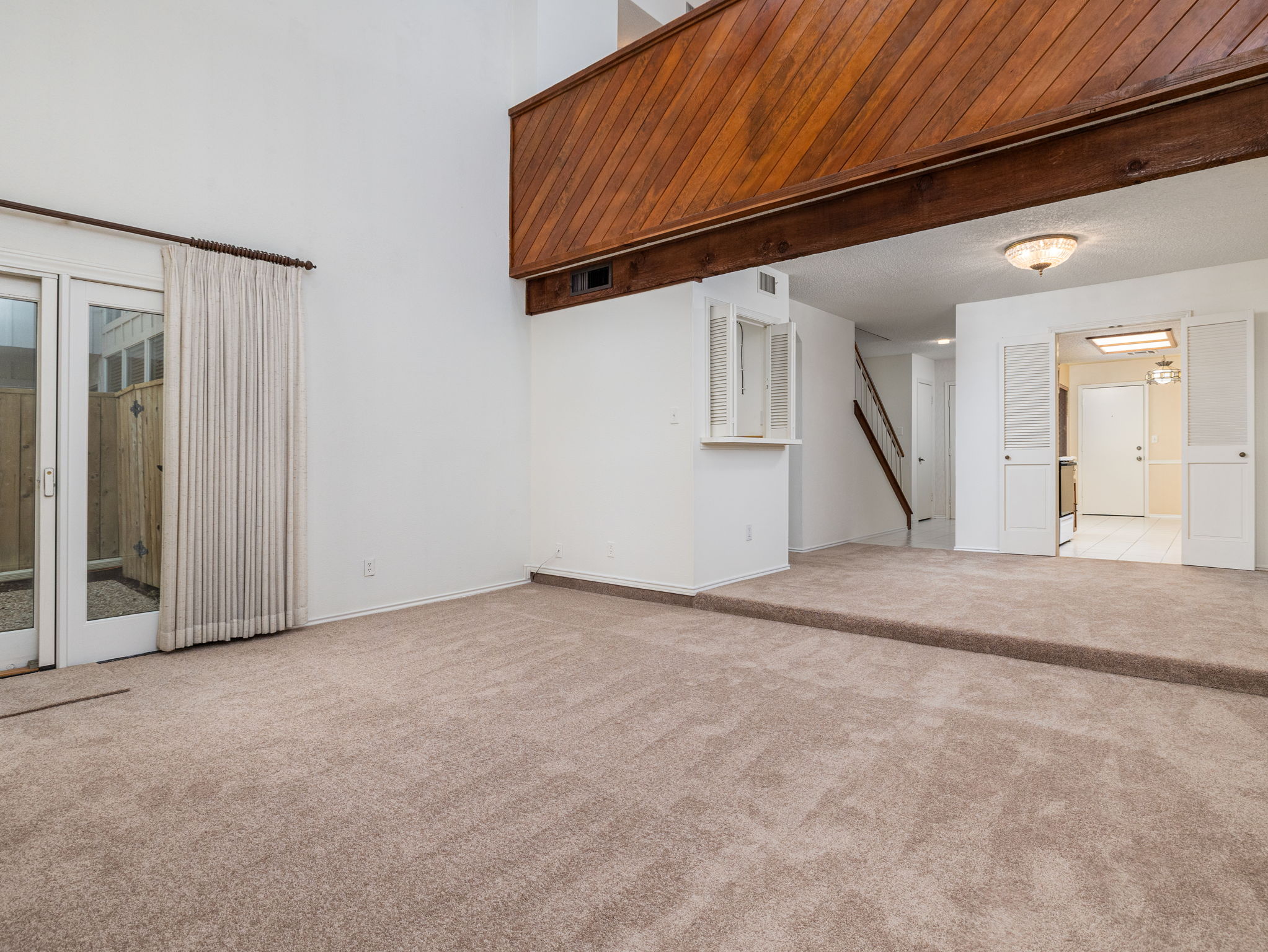 8216 Summer Side Drive Austin, TX 78759 - Photo 10 of 32 View of family room, dining area and upstairs loft from the fireplace
