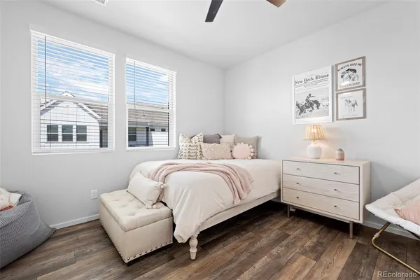 a bedroom with a bed and a couch
