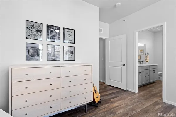 a view of closet with wooden floor