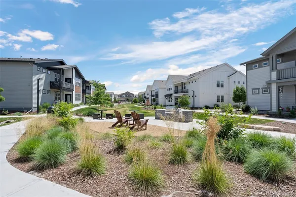 a view of a house with backyard porch and sitting area