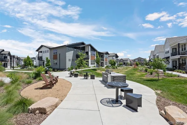 a view of a patio with a table and chairs