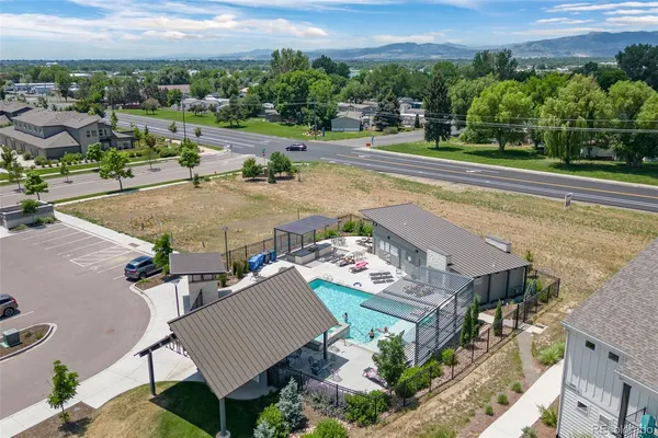 an aerial view of a house with a yard and outdoor seating