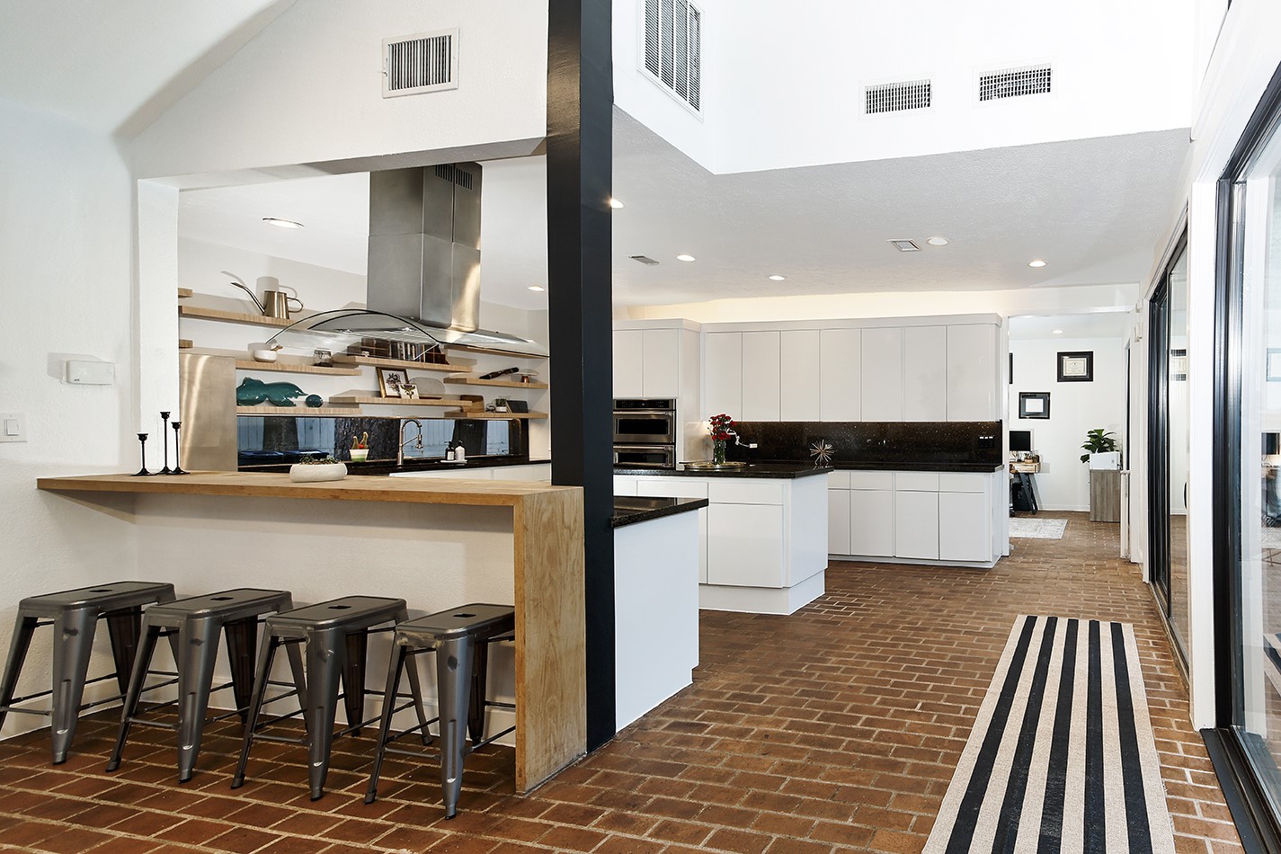 10 West Shady Lane Houston, TX 77063 - Photo 17 of 49 a kitchen with stainless steel appliances kitchen island granite countertop a refrigerator and microwave