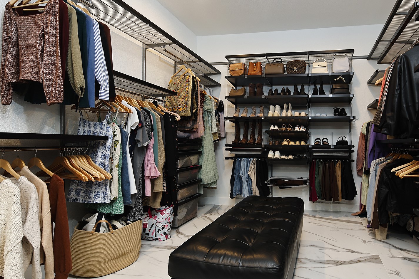 10 West Shady Lane Houston, TX 77063 - Photo 30 of 49 a view of walk in closet with clothes and shoes