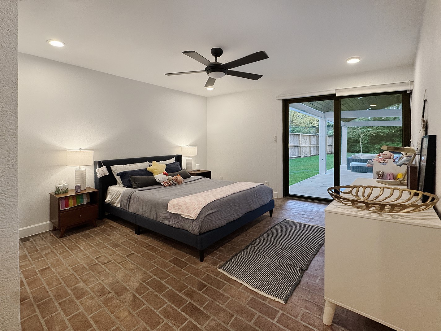 10 West Shady Lane Houston, TX 77063 - Photo 37 of 49 a bedroom with a bed and wooden floor