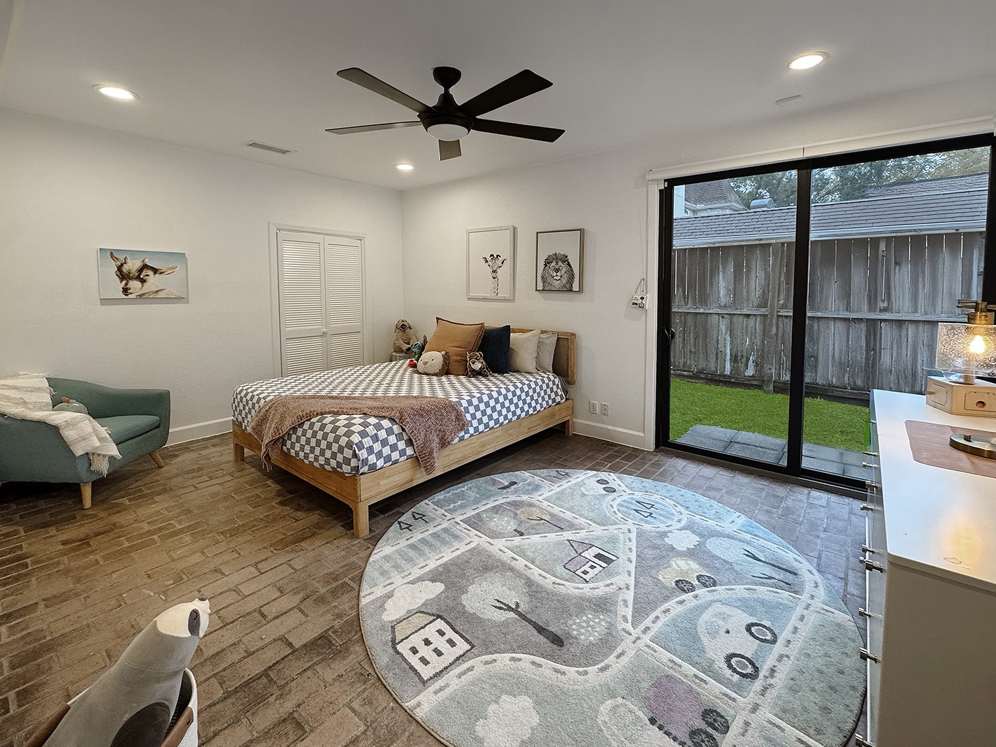 10 West Shady Lane Houston, TX 77063 - Photo 38 of 49 a spacious bedroom with a bed a dresser and a large window