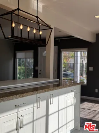 a kitchen with stainless steel appliances granite countertop a stove and a sink