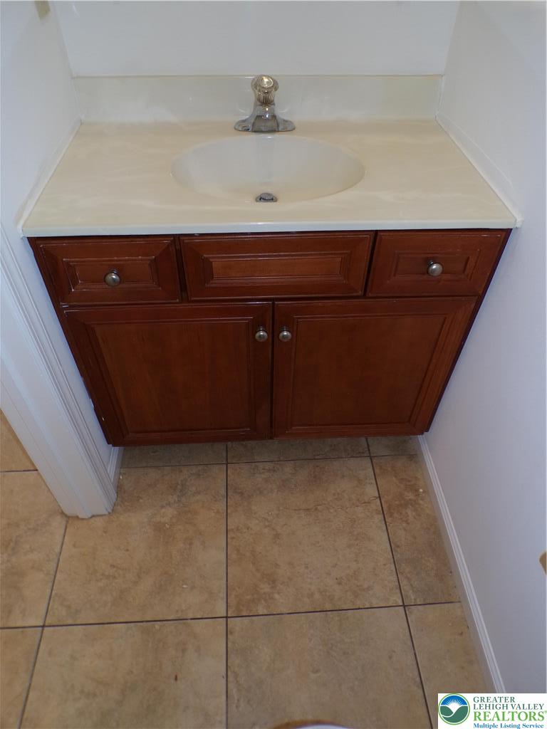 1013 Devonshire Road Allentown, PA 18103 - Photo 8 of 14 1st floor powder room
sink cabinet