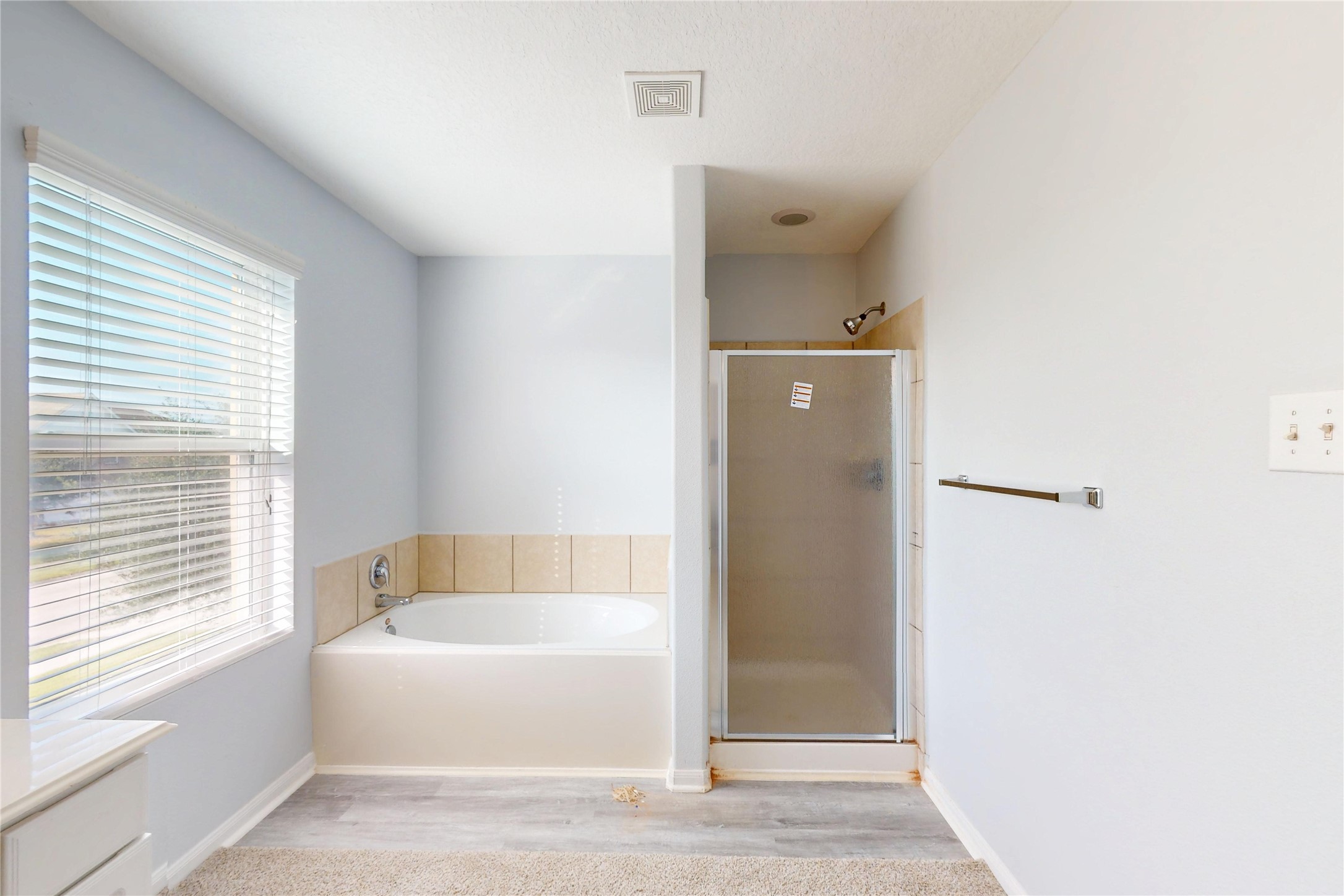 9877 Lace Flower Way Conroe, TX 77385 - Photo 25 of 43 a bathroom with a bathtub and shower