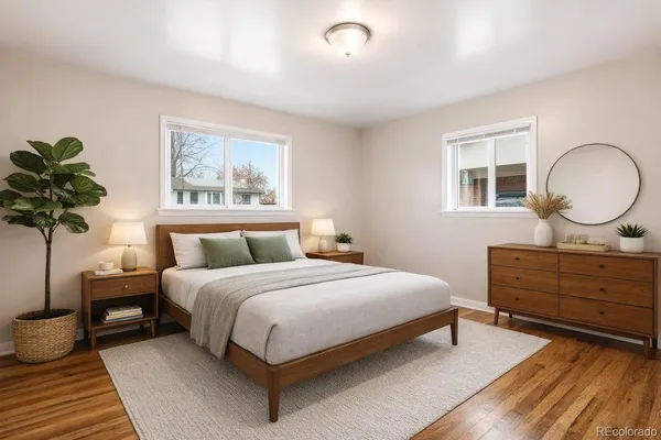 a bedroom with bed and a chandelier