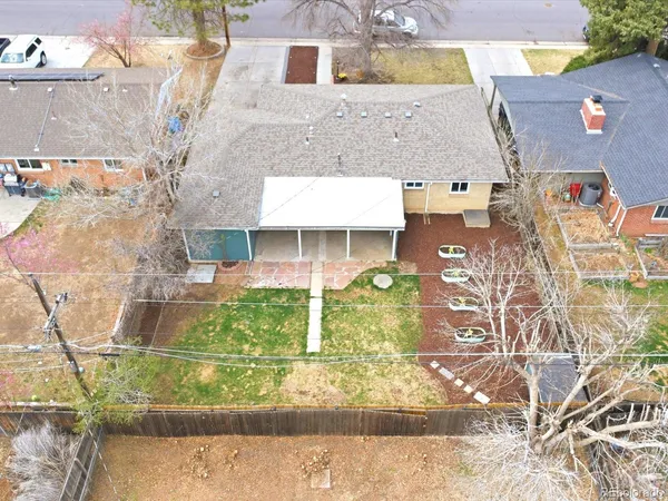 an aerial view of a house with a yard