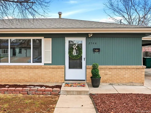a view of a entryway door front of a house