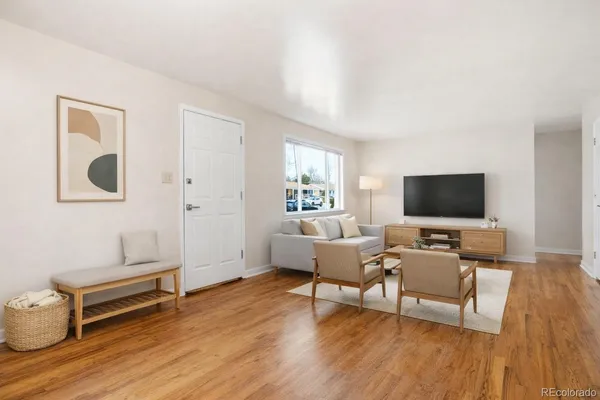 a living room with furniture and a flat screen tv
