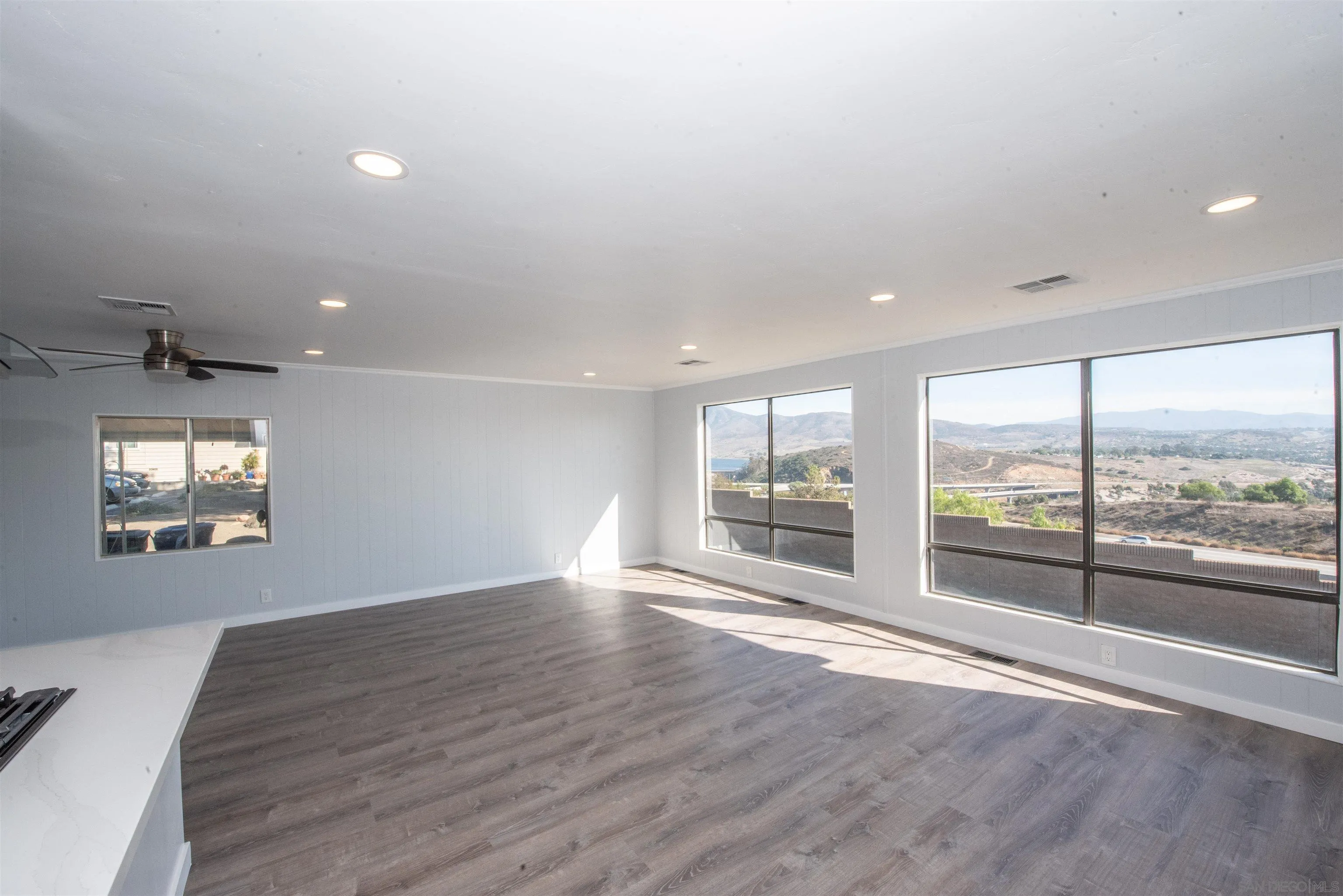 275 South Worthington Street, Unit 36 Spring Valley, CA 91977 - Photo 13 of 44 an empty room with wooden floor and windows