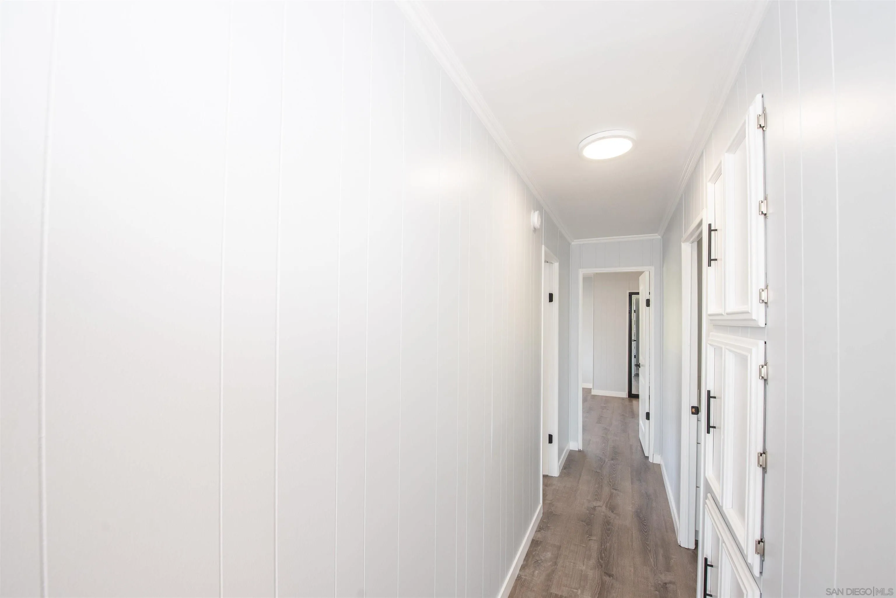 275 South Worthington Street, Unit 36 Spring Valley, CA 91977 - Photo 14 of 44 a view of a hallway with wooden floor
