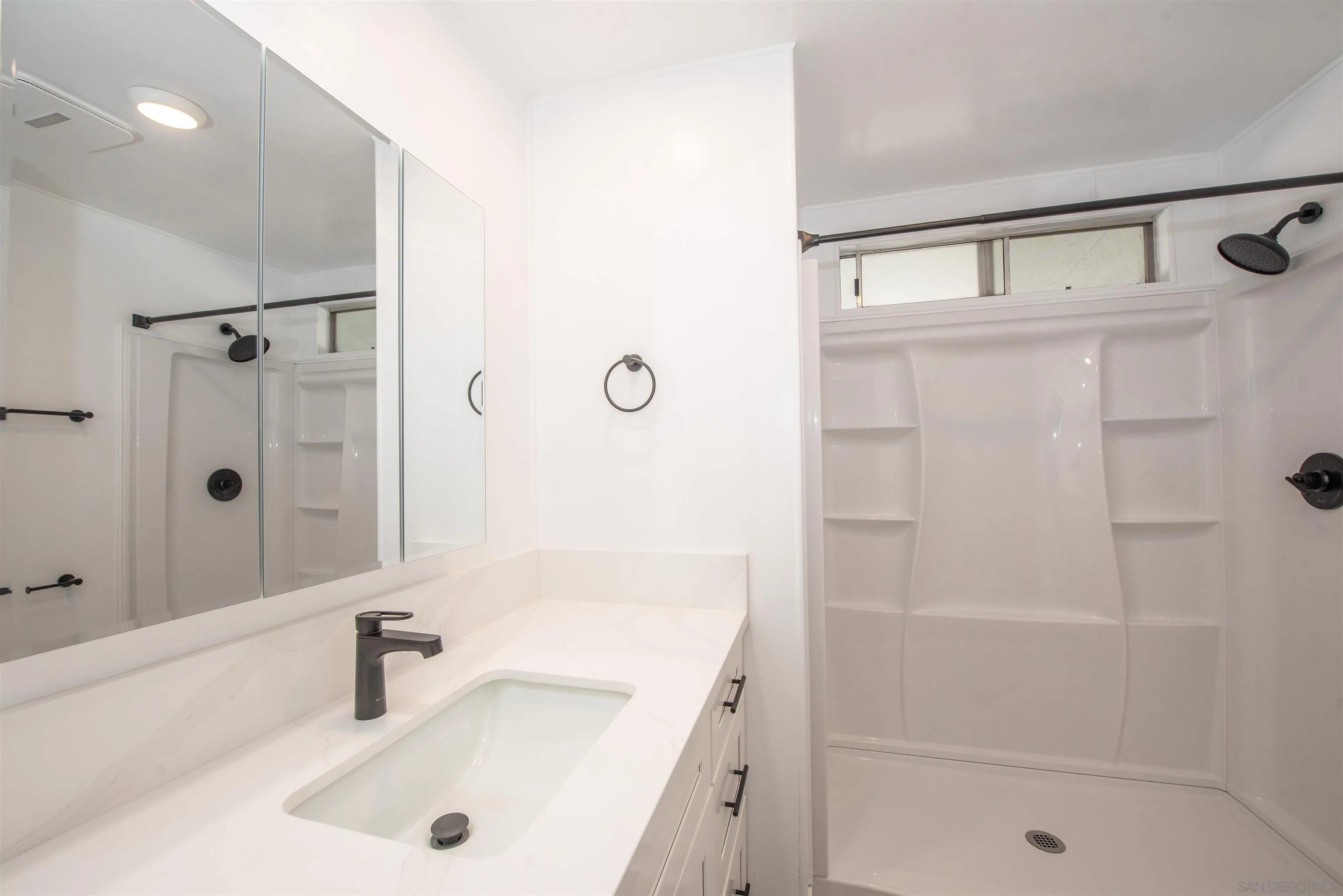 275 South Worthington Street, Unit 36 Spring Valley, CA 91977 - Photo 17 of 44 a bathroom with a tub a sink and a shower
