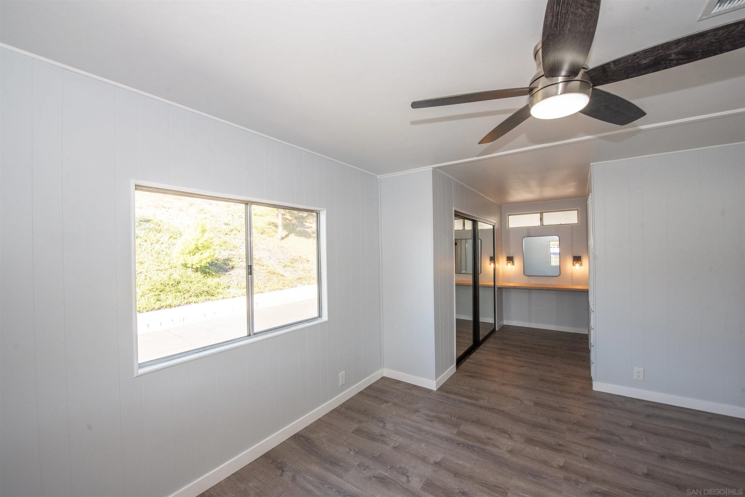 275 South Worthington Street, Unit 36 Spring Valley, CA 91977 - Photo 20 of 44 a view of an empty room with a window and wooden floor