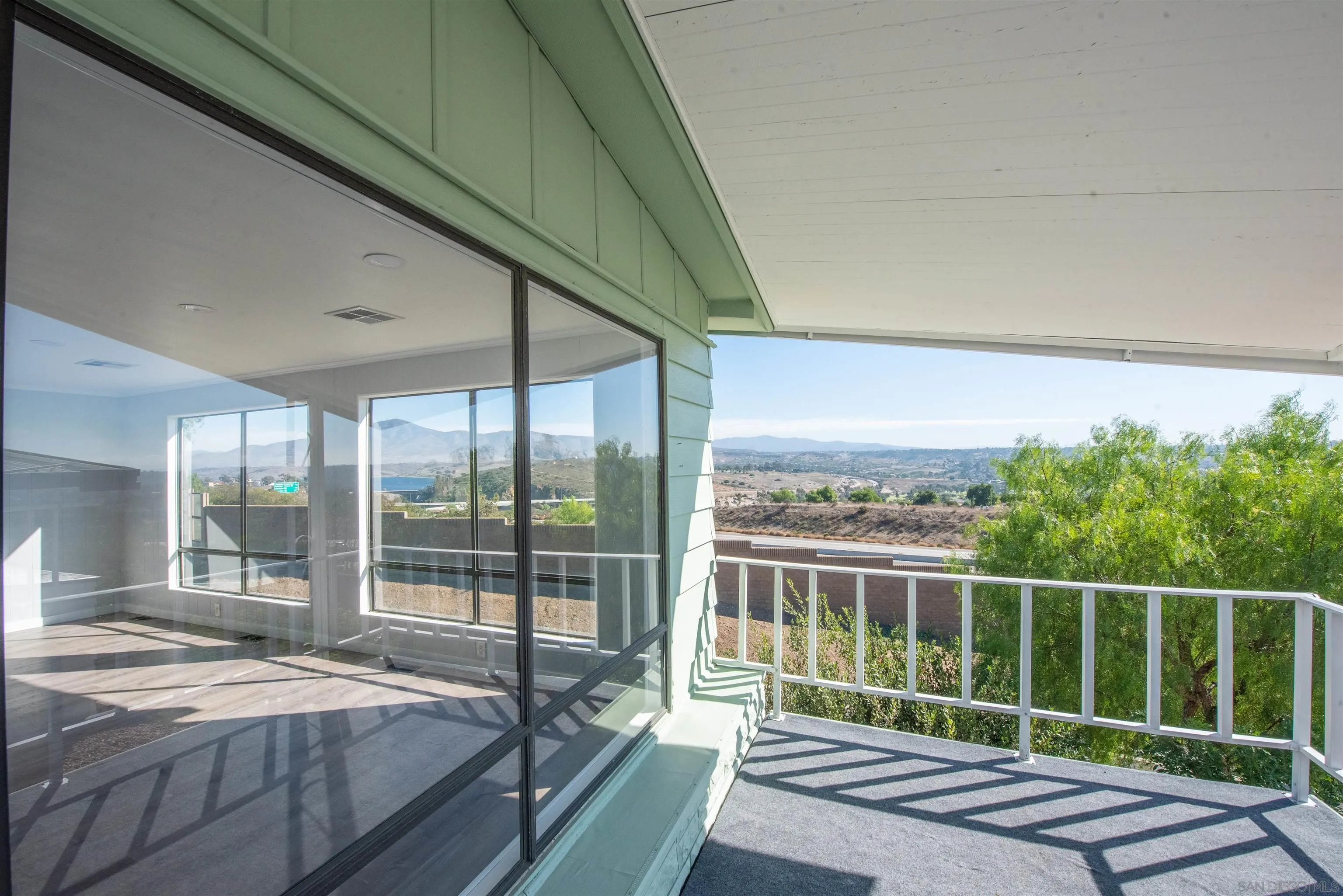 275 South Worthington Street, Unit 36 Spring Valley, CA 91977 - Photo 28 of 44 a bed sitting in a balcony next to a yard