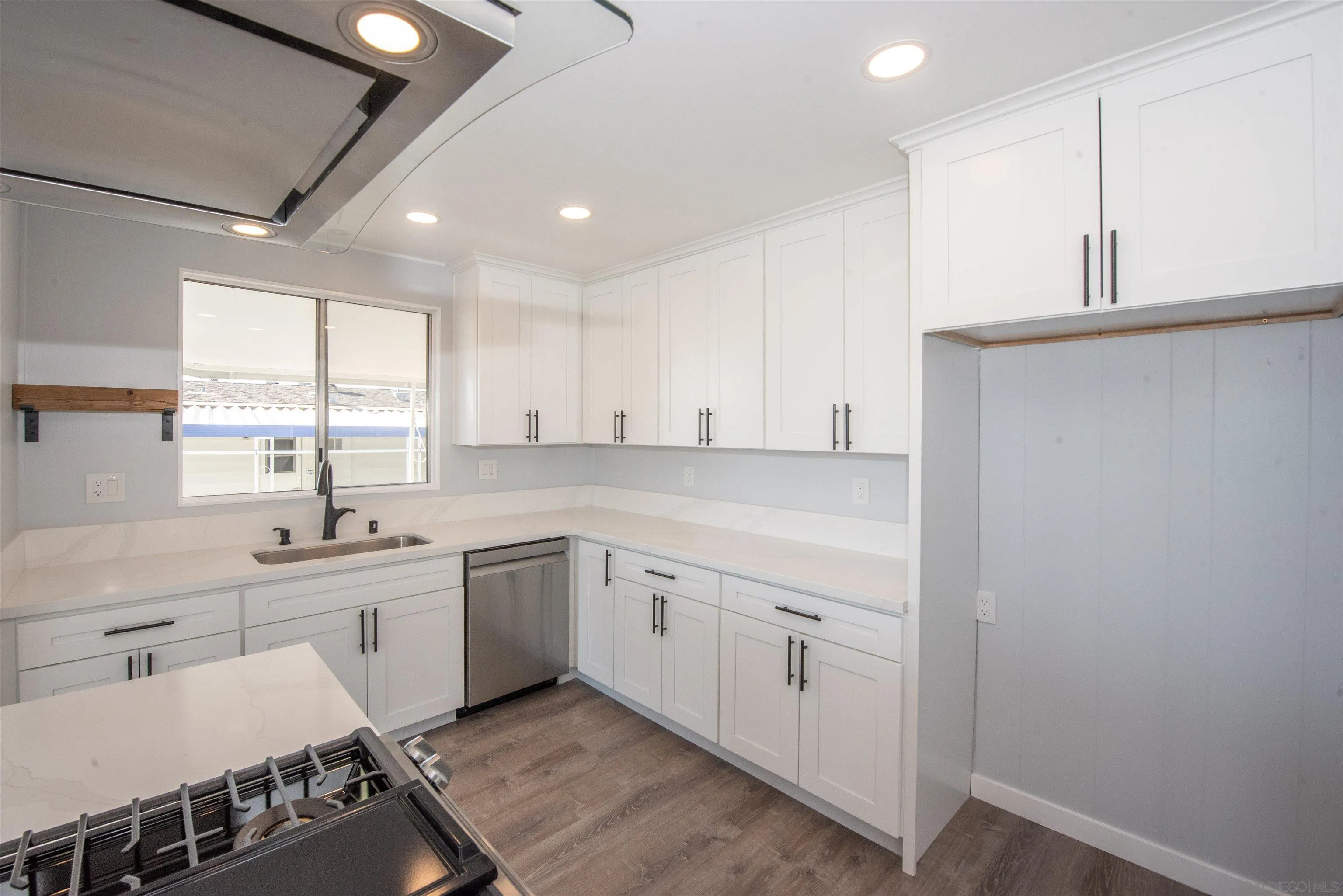 275 South Worthington Street, Unit 36 Spring Valley, CA 91977 - Photo 4 of 44 a kitchen with a sink stove and cabinets