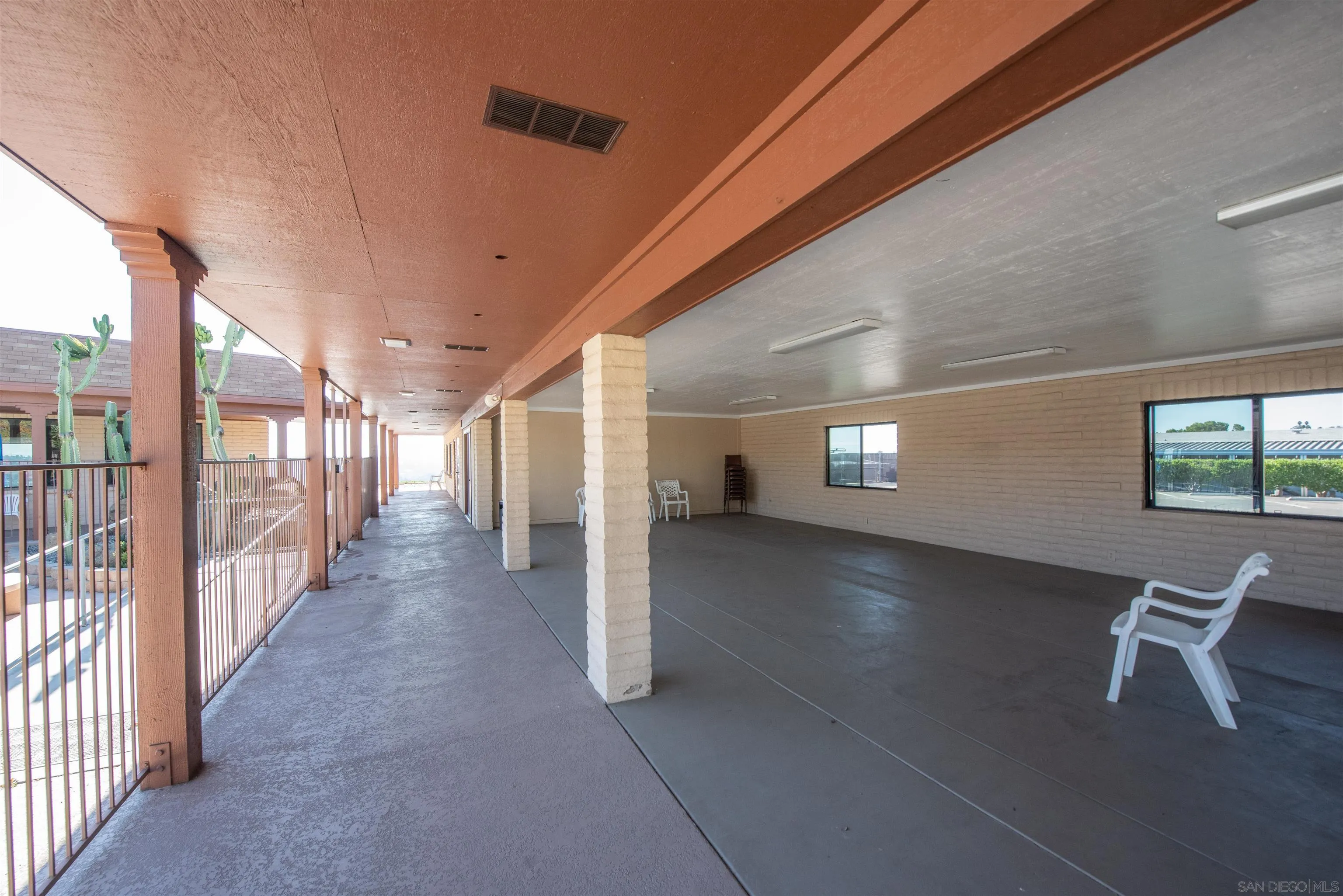 275 South Worthington Street, Unit 36 Spring Valley, CA 91977 - Photo 41 of 44 a view of a hallway with wooden floor and seating space