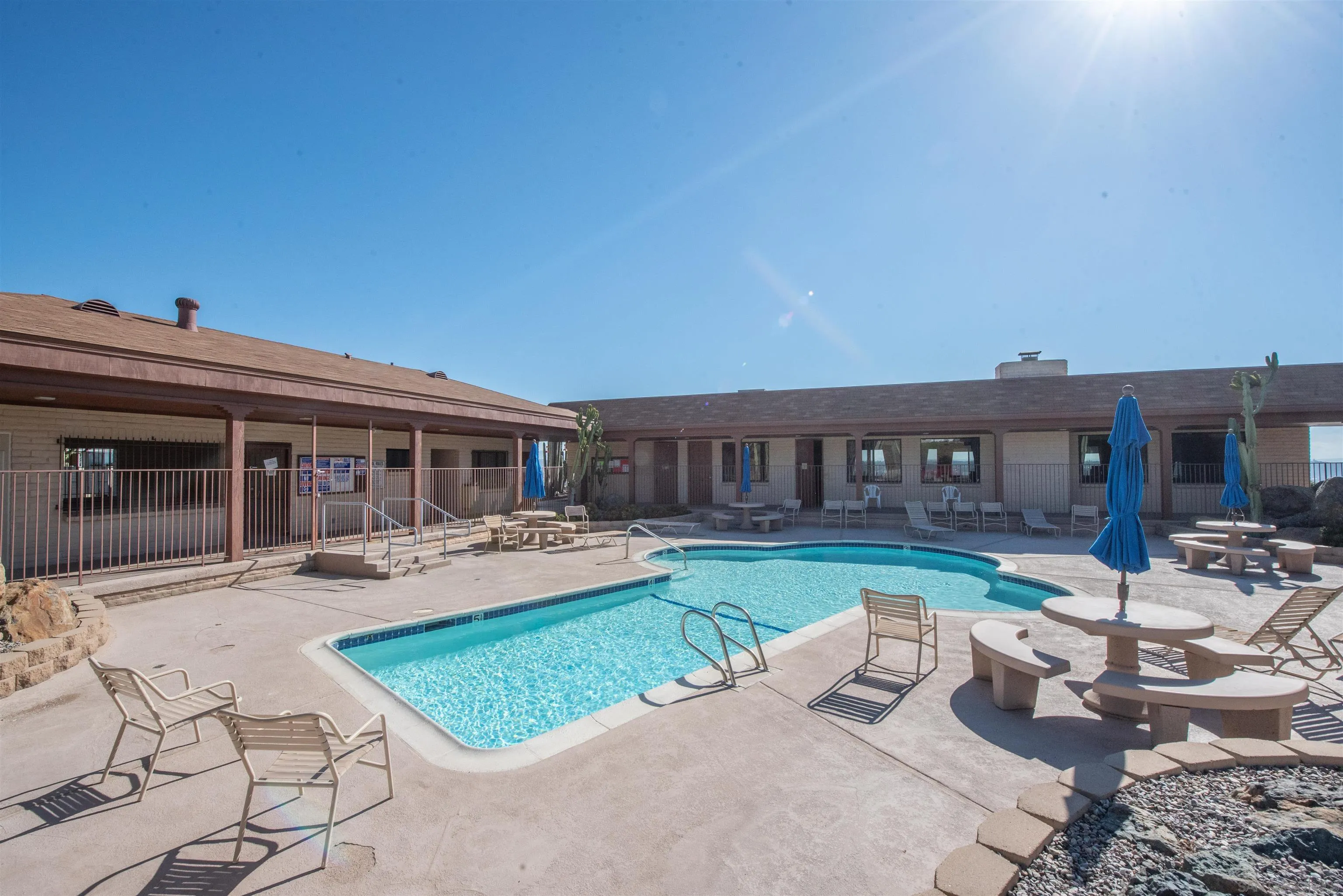 275 South Worthington Street, Unit 36 Spring Valley, CA 91977 - Photo 43 of 44 a view of a house with backyard sitting area and swimming pool