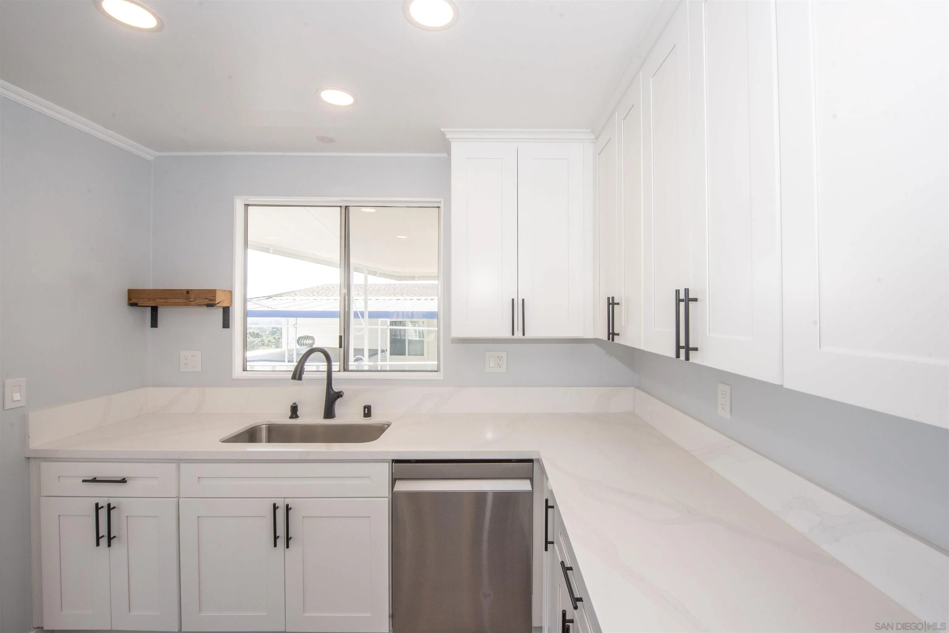 275 South Worthington Street, Unit 36 Spring Valley, CA 91977 - Photo 6 of 44 a kitchen with a sink cabinets and window
