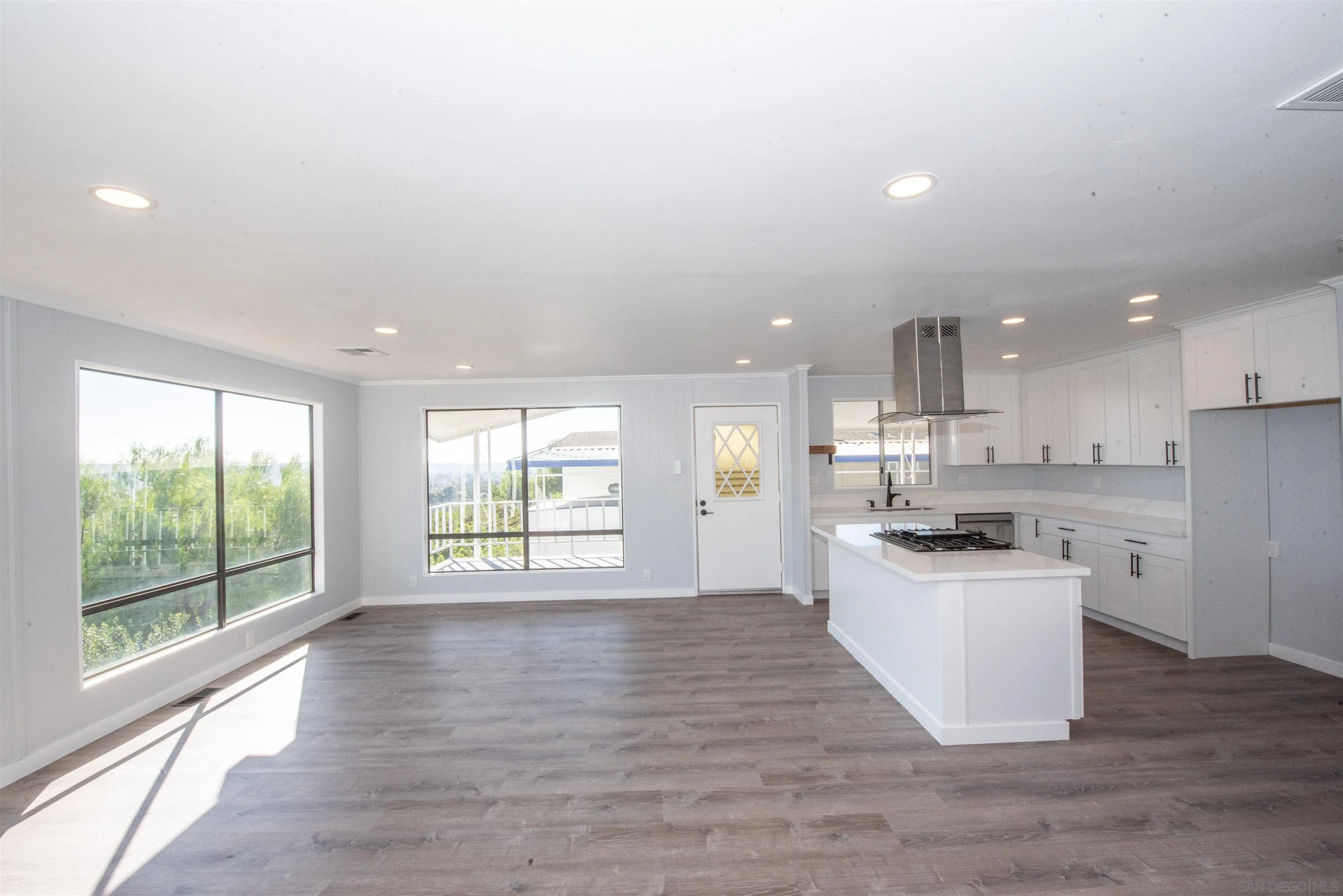 275 South Worthington Street, Unit 36 Spring Valley, CA 91977 - Photo 10 of 44 a large kitchen with stainless steel appliances granite countertop a stove a sink and a large window