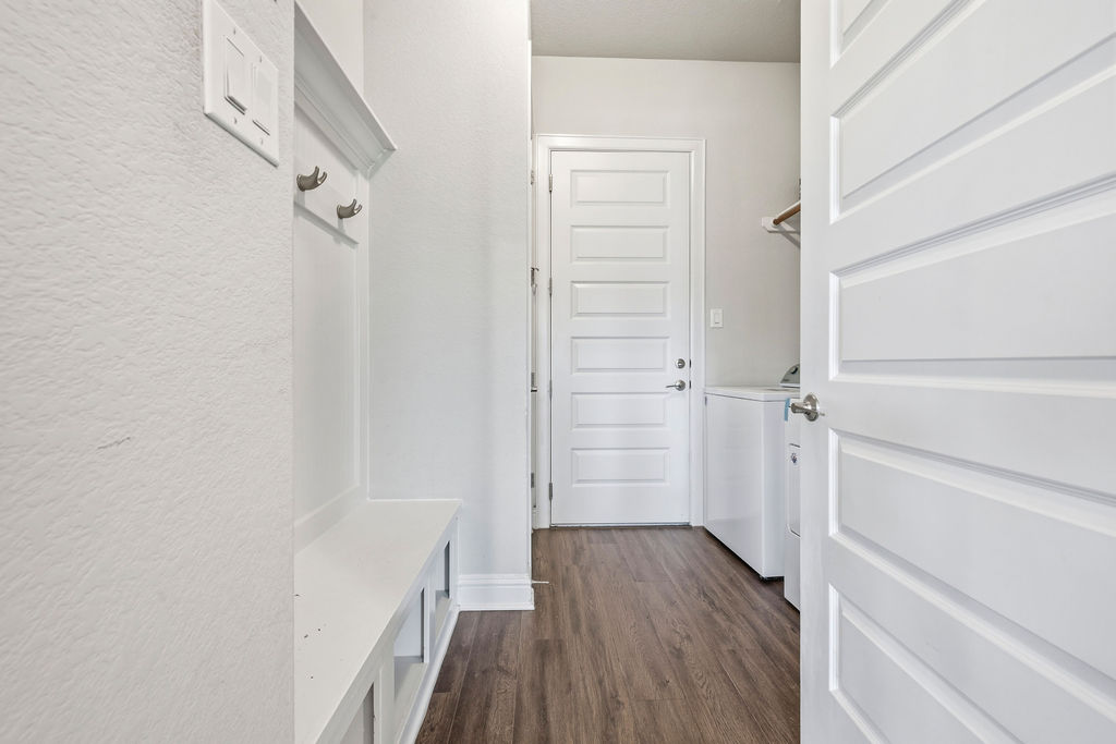 2032 Base Burner Path Leander, TX 78641 - Photo 17 of 34 Mudroom area featuring a built-in bench, wall-mounted coat hooks, and storage cubbies