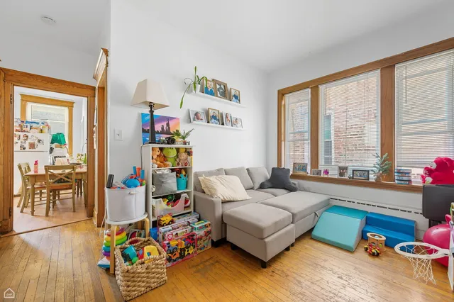 a bedroom with bed and a couch