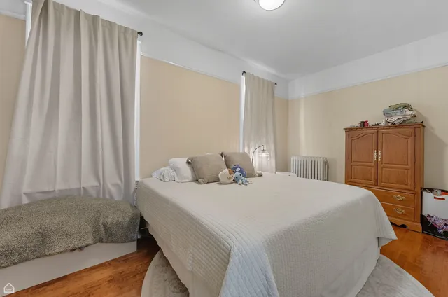 a bedroom with a bed and a closet