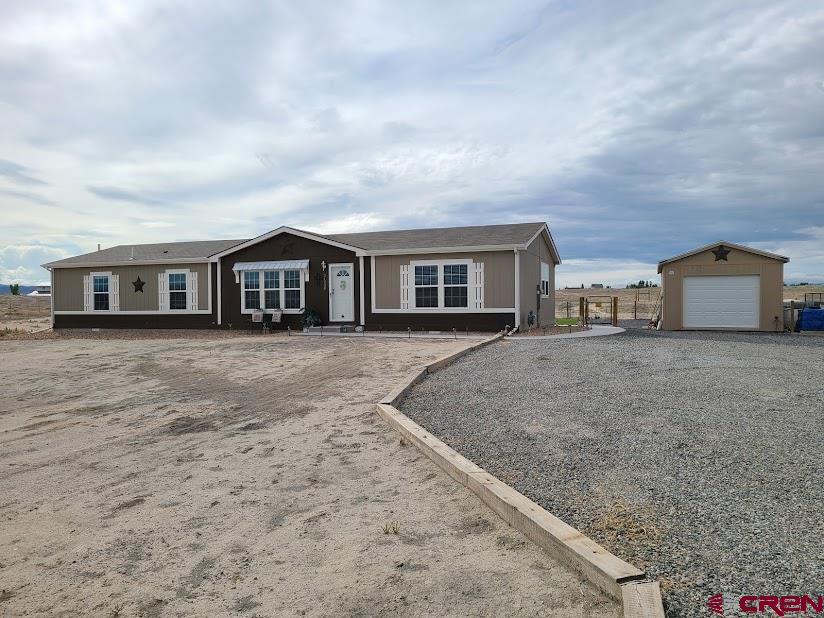 21238 Friendship Road Delta, CO 81416 - Photo 1 of 23 a view of houses with sky view