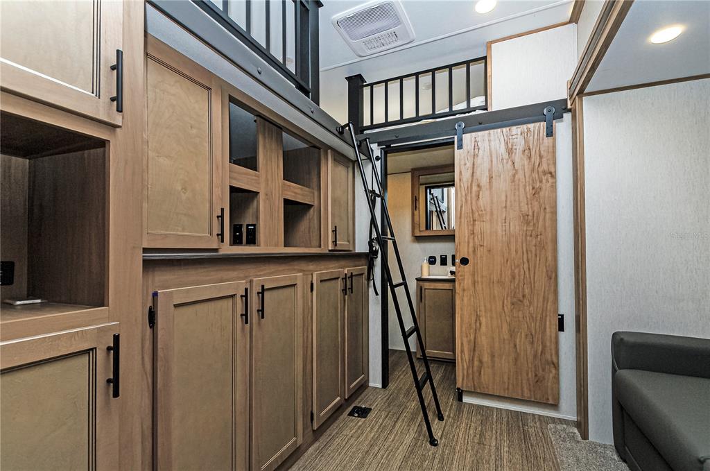 18233 185th Road Live Oak, FL 32060 - Photo 25 of 99 a view of a hallway with wooden floor and staircase