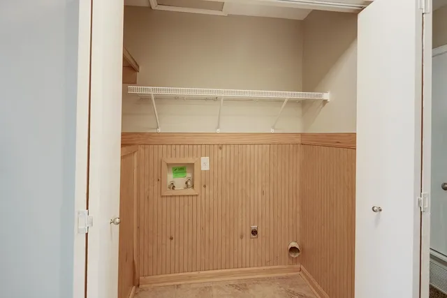 a bathroom with a granite countertop sink toilet and a mirror