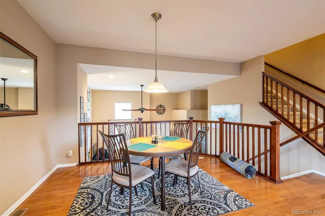 a dining room with furniture a rug and a chandelier