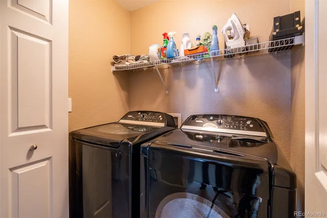 a view of a stove top oven sitting inside of a kitchen