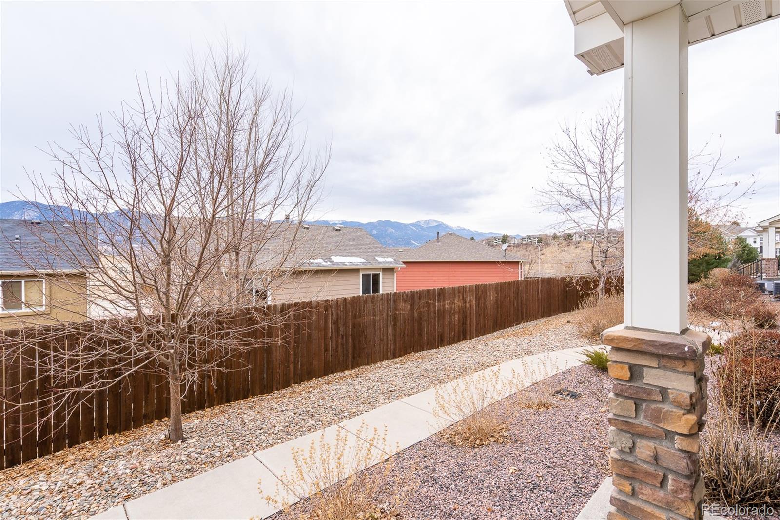 2681 Stonecrop Ridge Grove Colorado Springs, CO 80910 - Photo 5 of 26 a view of balcony with wooden floor and fence
