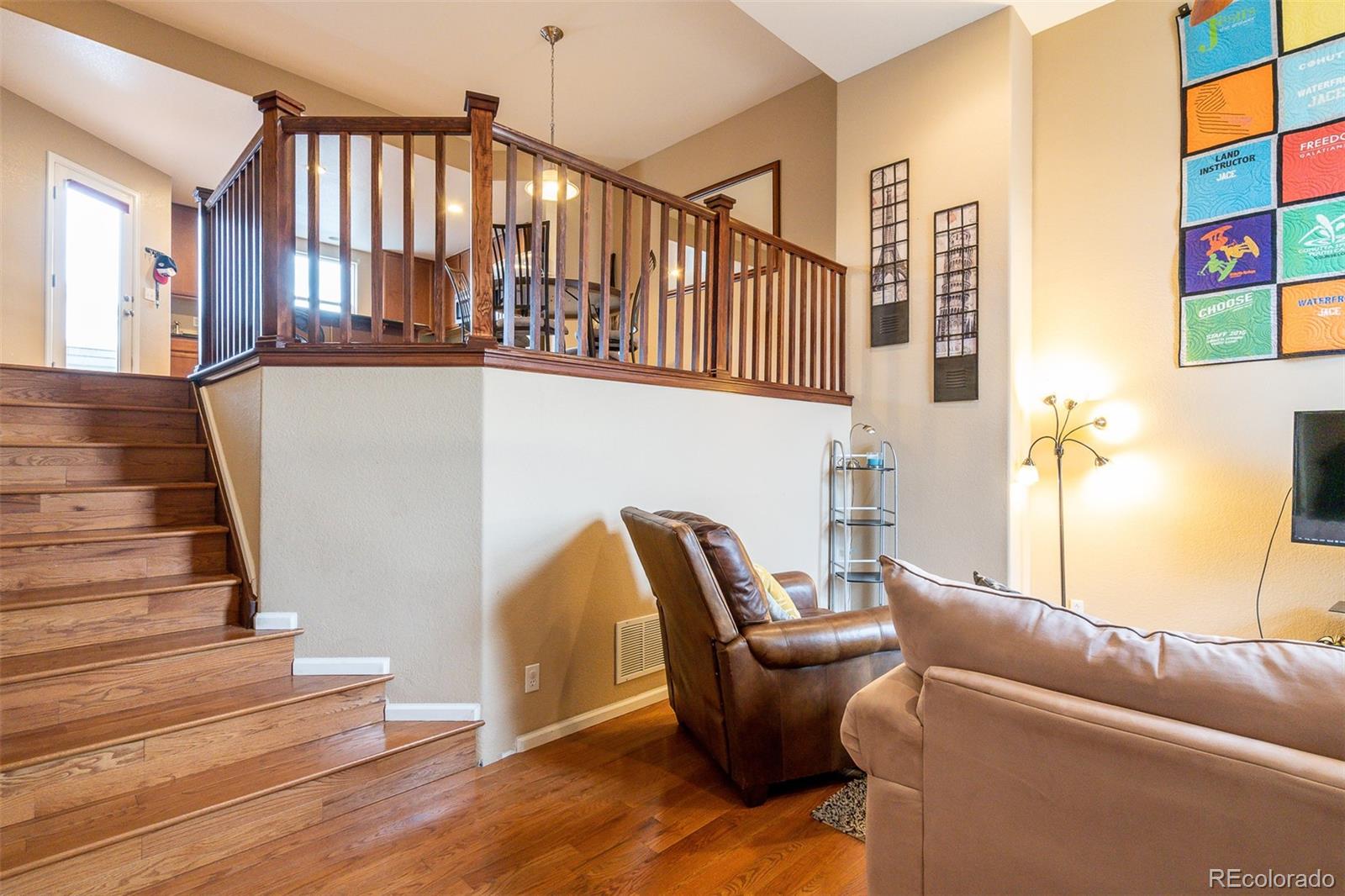 2681 Stonecrop Ridge Grove Colorado Springs, CO 80910 - Photo 9 of 26 a view of entryway and hall with wooden floor