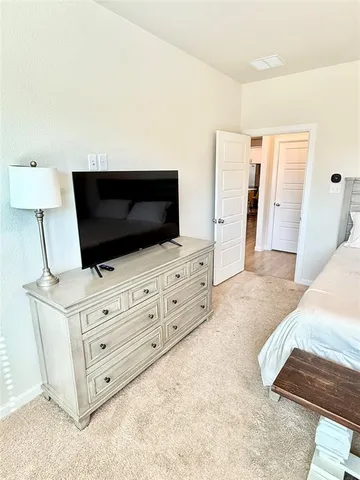 a living room with furniture and flat screen tv