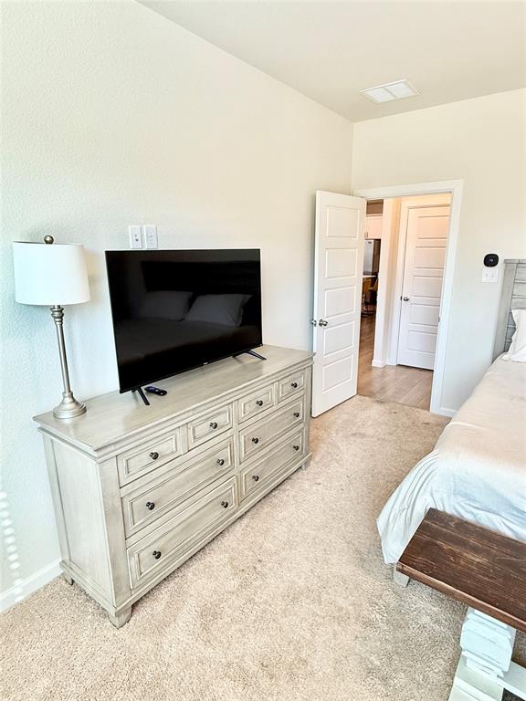 603 Hazeltine Road Red Oak, TX 75154 - Photo 18 of 37 a living room with furniture and flat screen tv