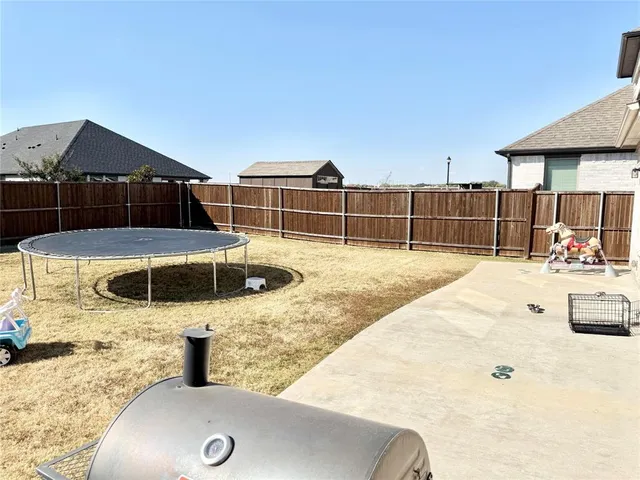 a swimming pool with outdoor seating