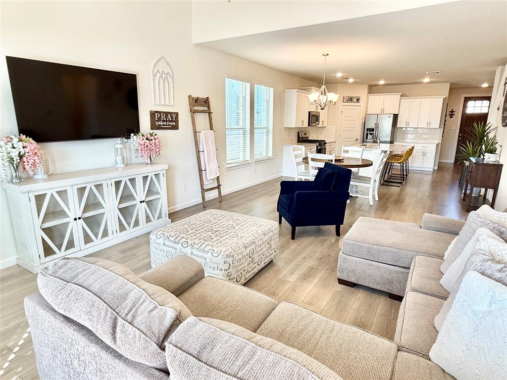 603 Hazeltine Road Red Oak, TX 75154 - Photo 5 of 37 a living room with furniture and a flat screen tv