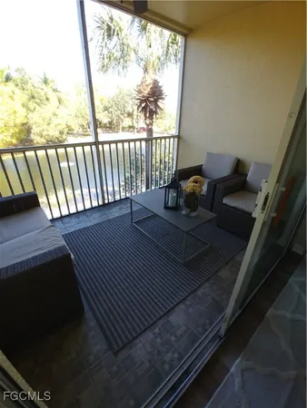 a view of balcony with wooden floor