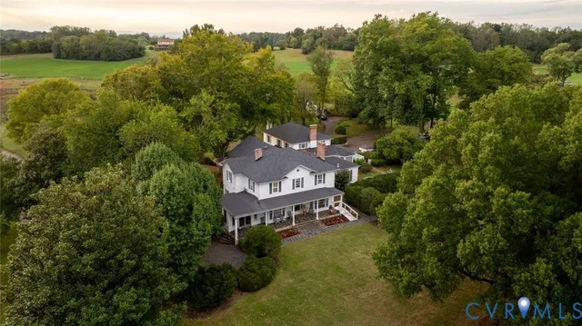 an aerial view of a house with a garden