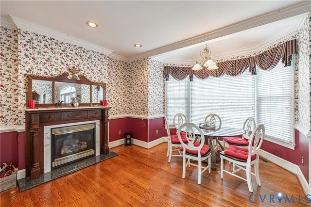 a dining room with furniture and window